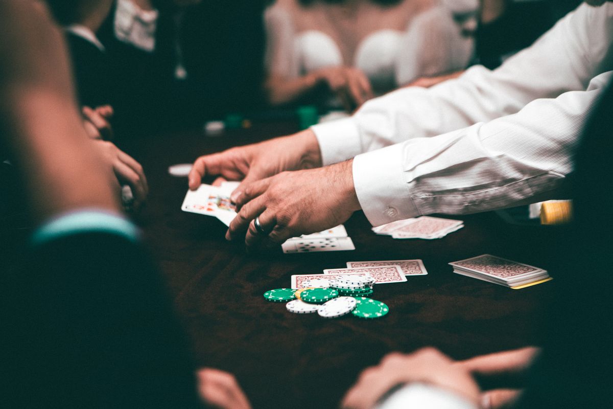 Poker player holding a hand of cards